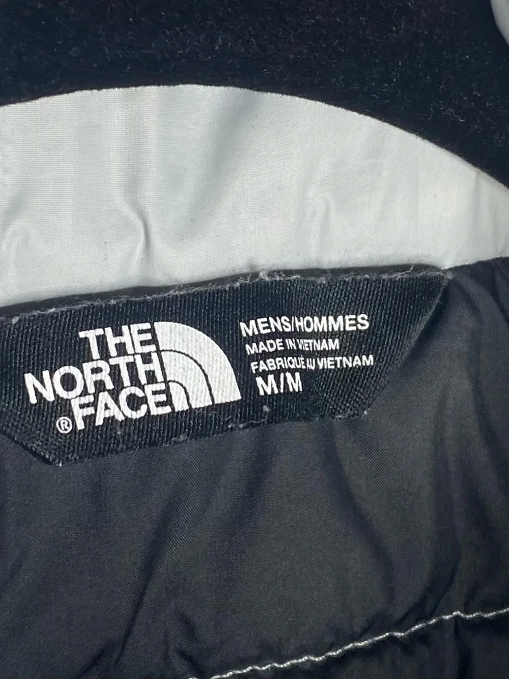 The North Face Light Gray Puffer Jacket with Black Zip Trim